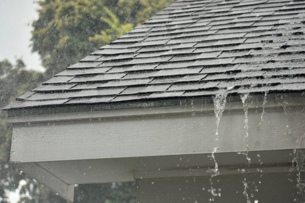 Heavy rain pouring down on a Florida home's roof. 